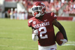 Arkansas defensive back Kamren Curl returns an interception against Portland State in the first half of an NCAA college football game, Saturday, Aug. 31, 2019 in Fayetteville, Ark. (AP Photo/Michael Woods)