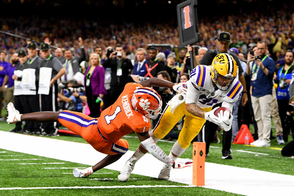 NEW ORLEANS, LA - JANUARY 13: Thaddeus Moss #81 of the LSU Tigers scores a touchdown against Derion Kendrick #1 of the Clemson Tigers during the College Football Playoff National Championship held at the Mercedes-Benz Superdome on January 13, 2020 in New Orleans, Louisiana. (Photo by Jamie Schwaberow/Getty Images)
