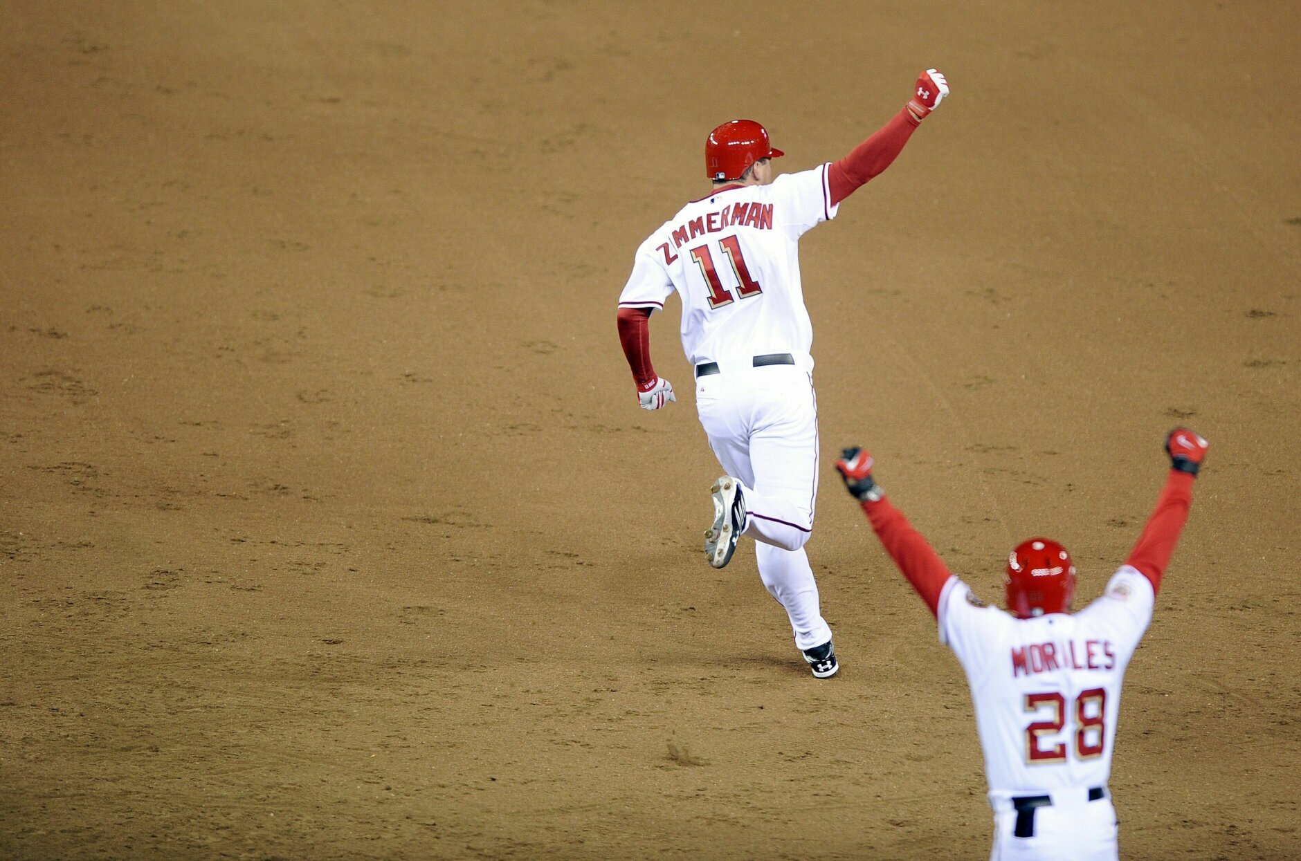 WASHINGTON - MARCH 30:  Ryan Zimmerman #11 of the Washington Nationals rounds the bases after hitting the game winning home-run in the bottom of the 9th inning against the Atlanta Braves on opening day on March 30, 2008 at Nationals Park in Washington, D.C. The Nationals won 3-2. (Photo by G Fiume/Getty Images)