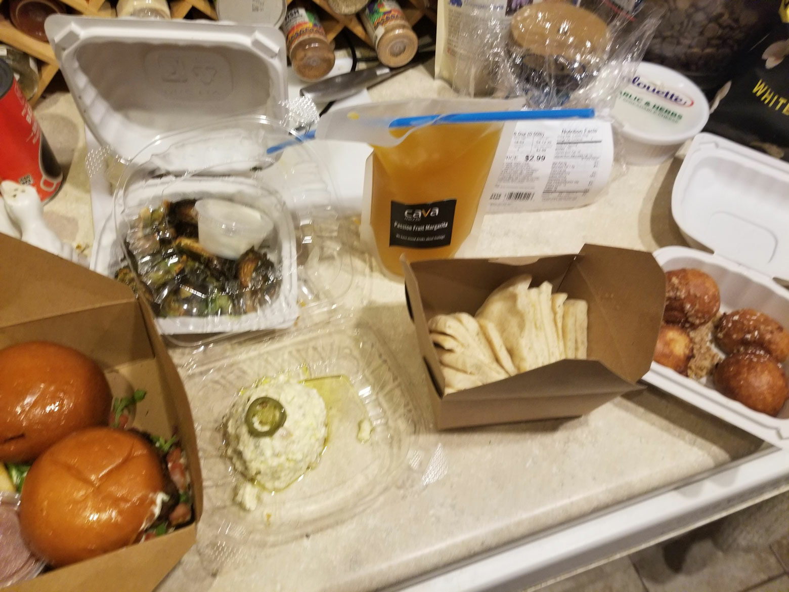 <p>Reader Rebecca Didio in D.C. said she ordered this meal from <a href="http://www.cavamezze.com/order-online" target="_blank" rel="noopener">Cava Mezze</a> on Capitol Hill via DoorDash. It cost about $80 including tax, service fee and tip. &#8220;From left to right, it&#8217;s lamb sliders, Brussels sprouts, crazy feta with pita, passion fruit margarita, and they threw in some Greek doughnut holes for free!&#8221; she wrote.</p>
