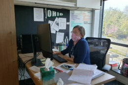 WTOP Senior Digital Editor Colleen Kelleher wearing her face mask while working.