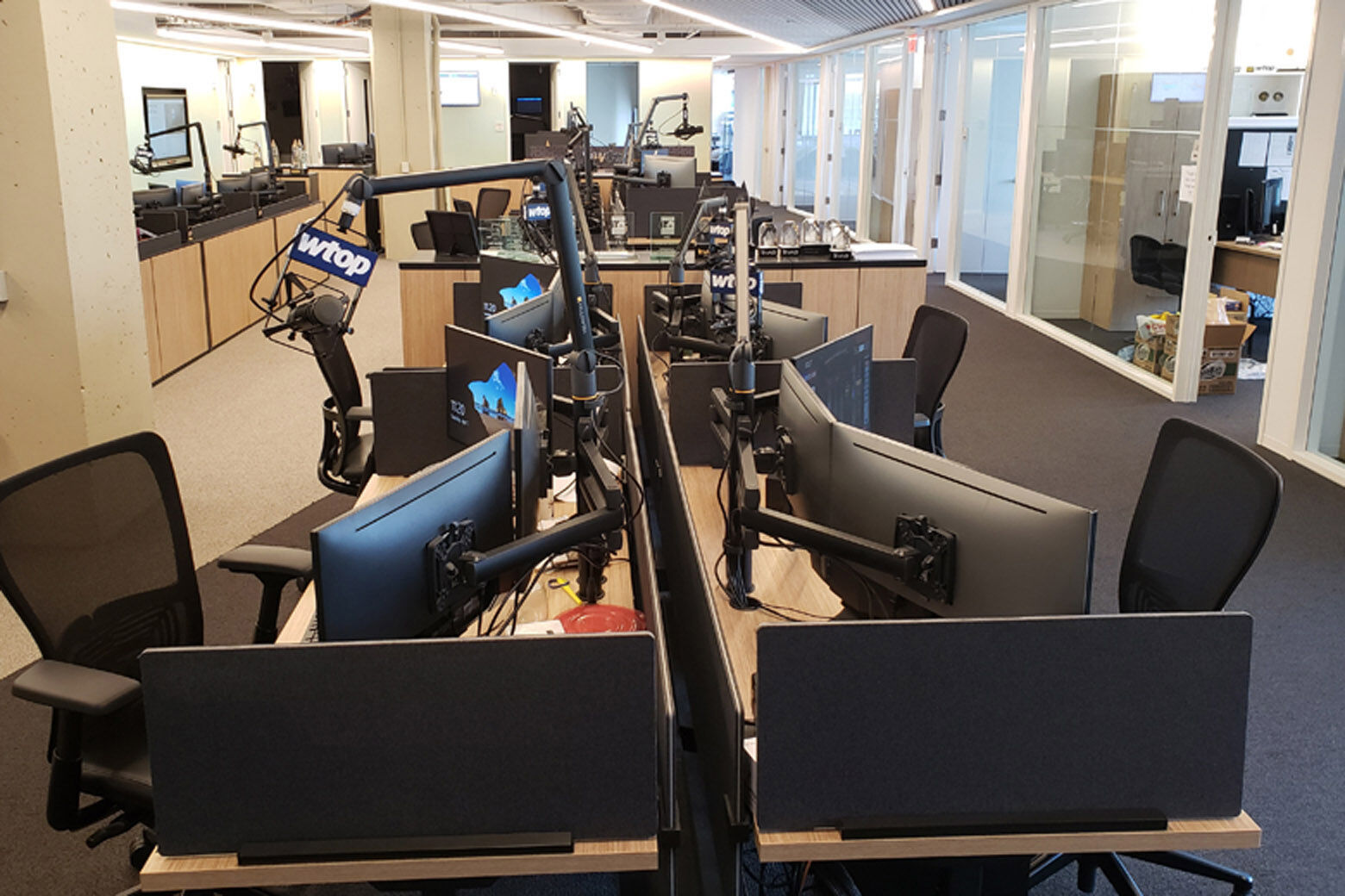Empty desks and chairs in the WTOP newsroom.