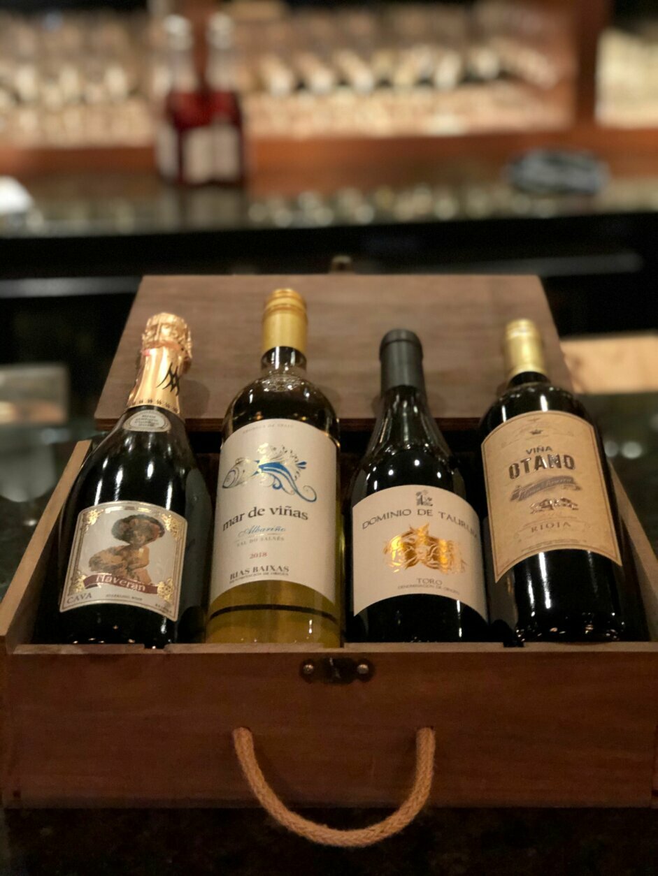 <p>The restaurants SER (Arlington) and Joselito (Capitol Hill) are offering meals like a roasted chicken with sides for four, but also putting together 4-pack boxes of wine that <a href="https://serrestaurant.com/" target="_blank" rel="noopener">can be delivered</a>. Wine selection changes each week, but four bottles go for $80 before a delivery fee. (Courtesy SER)</p>
