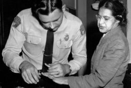FILE - In this Feb. 22, 1956, file photo, Rosa Parks is fingerprinted by police Lt. D.H. Lackey in Montgomery, Ala., two months after refusing to give up her seat on a bus for a white passenger on Dec. 1, 1955. She was arrested with several others who violated segregation laws. Parks' refusal to give up her seat led to a boycott of buses by blacks in December 1955, a tactic organized by the Rev. Dr. Martin Luther King Jr., which ended after the U.S. Supreme Court deemed that all segregation was unlawful on Dec. 20, 1956. (AP Photo/Gene Herrick, File)