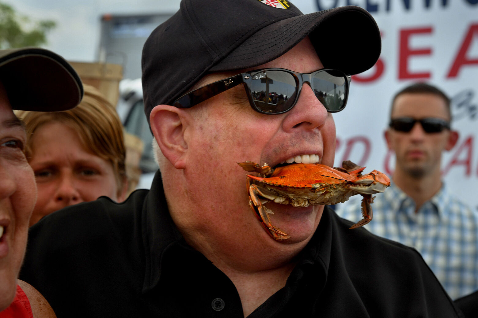Gov. Hogan with a crab in his mouth.