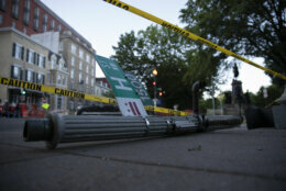 The H Street NW post lies on the ground marked off with yellow police tape in Washington, Monday, June 1, 2020, in protests over the death of George Floyd. Floyd died after being restrained by Minneapolis police officers. (AP Photo/Carolyn Kaster)