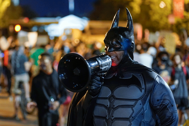 Demonstrator dressed as Batman