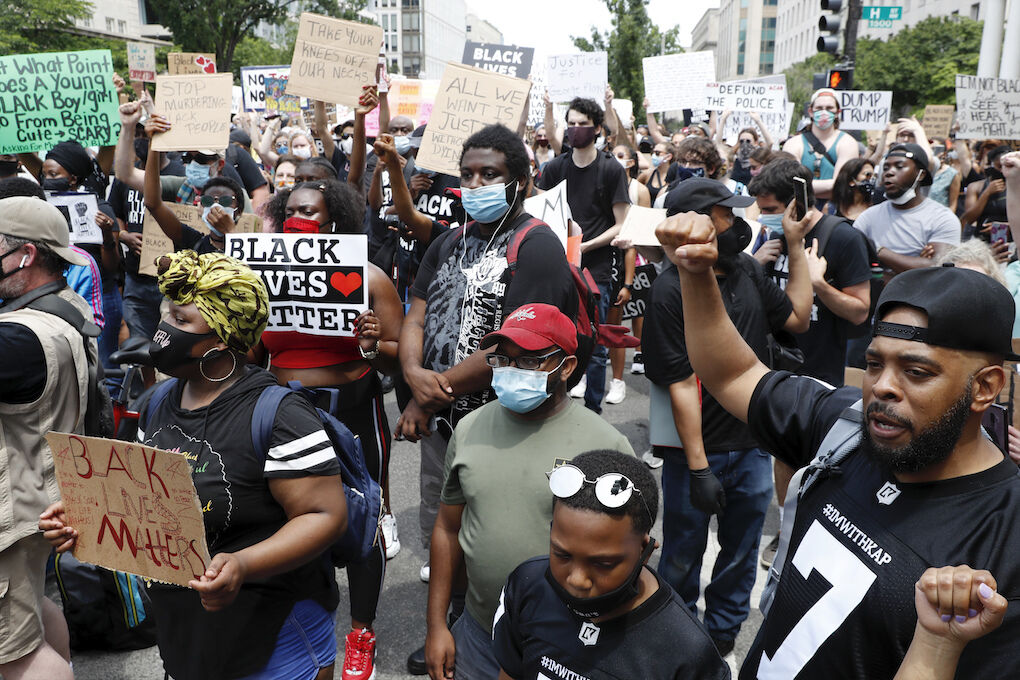 Demonstrators protest Saturday, June 6, 2020, near the White House in Washington, over the death of George Floyd, a black man who was in police custody in Minneapolis. Floyd died after being restrained by Minneapolis police officers. (AP Photo/Jacquelyn Martin)