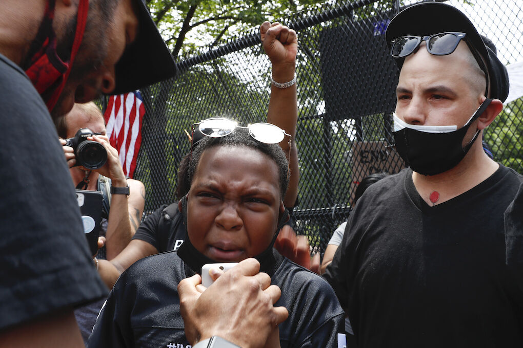 Demonstrators, including NarDre Thompson, 12, of Washington, protests Saturday, June 6, 2020, near the White House in Washington, over the death of George Floyd, a black man who was in police custody in Minneapolis. Floyd died after being restrained by Minneapolis police officers. (AP Photo/Jacquelyn Martin)
