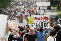 Demonstrators protest Saturday, June 6, 2020, as they walk away from the Lincoln Memorial in Washington, over the death of George Floyd, a black man who was in police custody in Minneapolis. Floyd died after being restrained by Minneapolis police officers. (AP Photo/Alex Brandon)