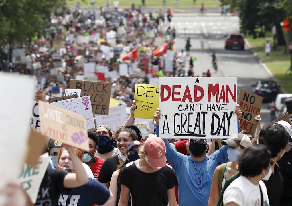Demonstrators protest Saturday, June 6, 2020, as they walk away from the Lincoln Memorial in Washington, over the death of George Floyd, a black man who was in police custody in Minneapolis. Floyd died after being restrained by Minneapolis police officers. (AP Photo/Alex Brandon)