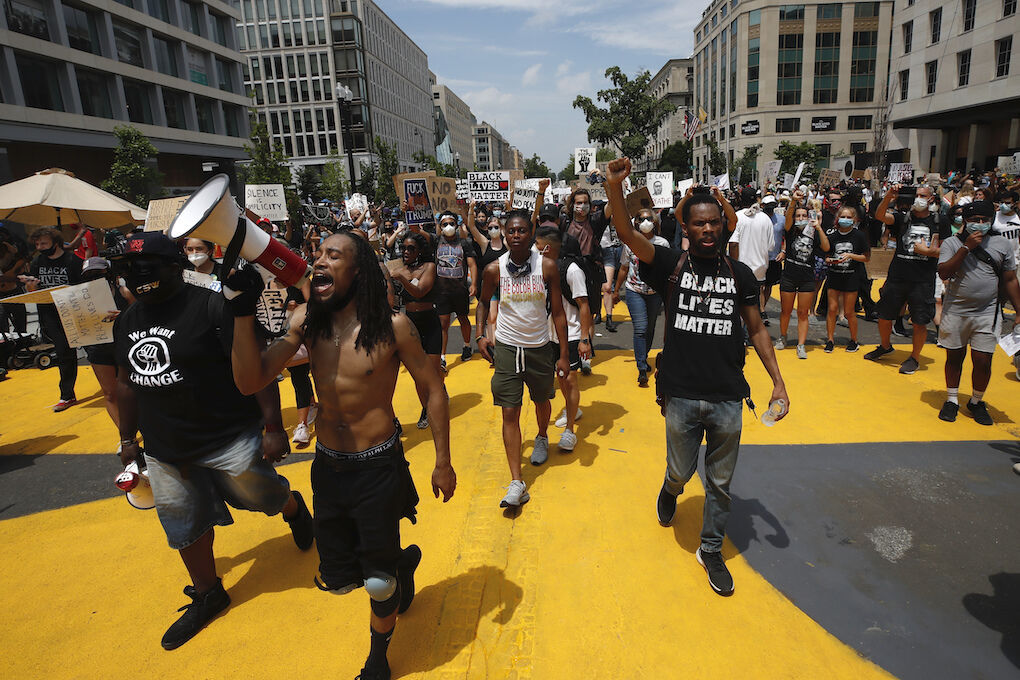 Demonstrators protest Saturday, June 6, 2020, near the White House in Washington, over the death of George Floyd, a black man who was in police custody in Minneapolis. Floyd died after being restrained by Minneapolis police officers. (AP Photo/Alex Brandon)