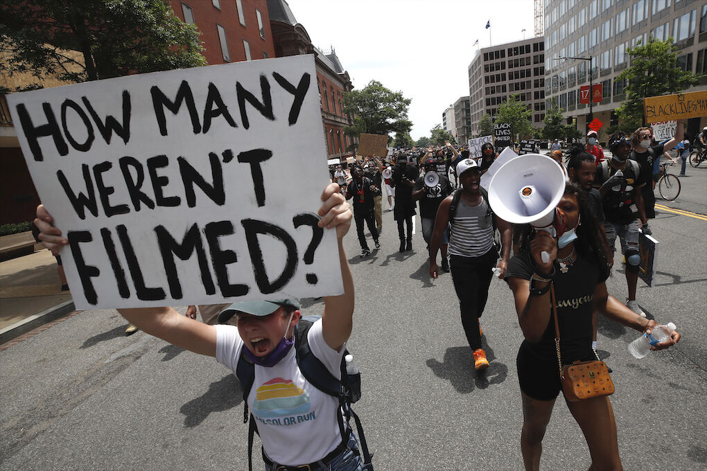 Demonstrators protest Saturday, June 6, 2020, in Washington, over the death of George Floyd, a black man who was in police custody in Minneapolis. Floyd died after being restrained by Minneapolis police officers. (AP Photo/Alex Brandon)
