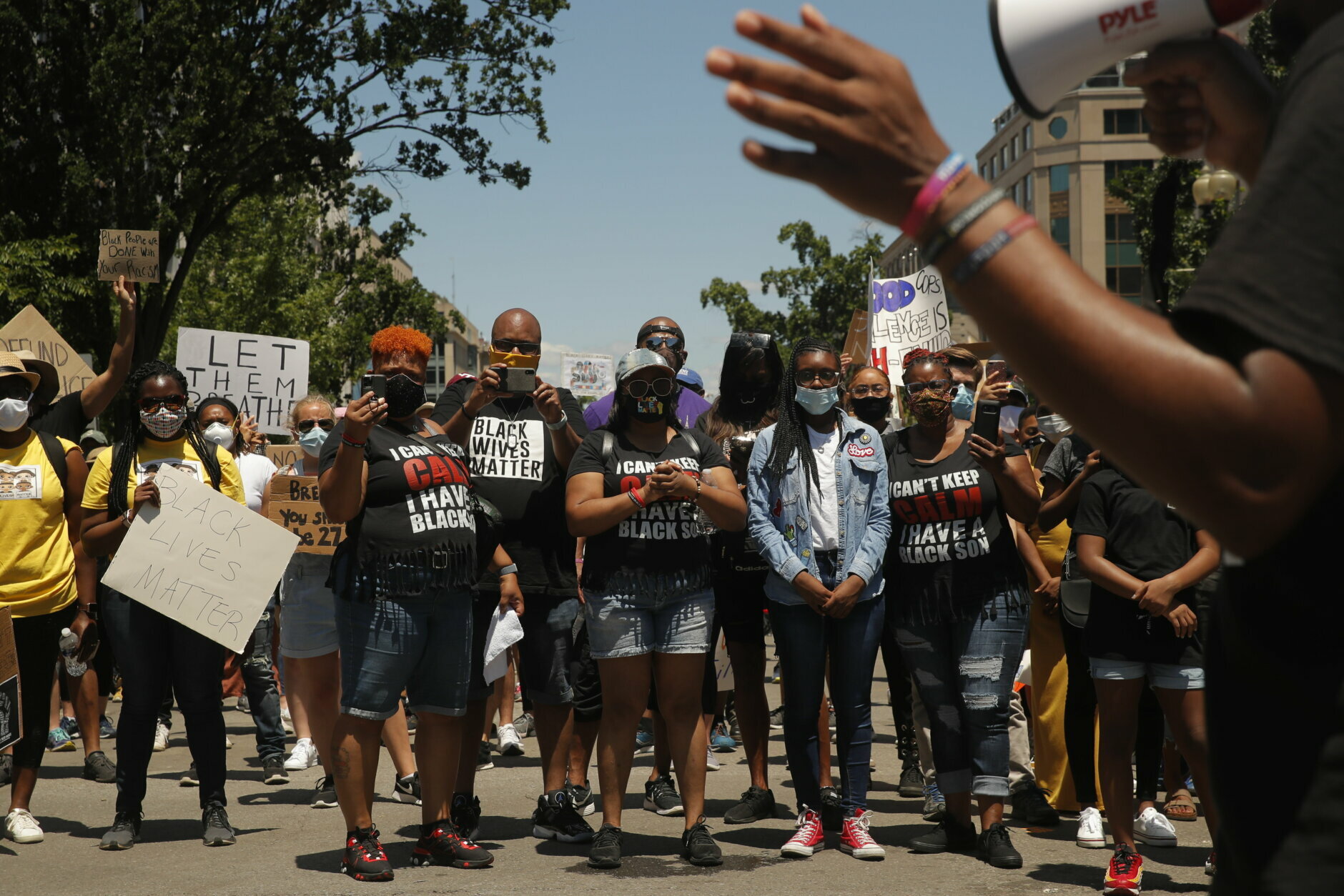 Demonstrators protest Sunday, June 7, 2020, near the White House in Washington, over the death of George Floyd, a black man who was in police custody in Minneapolis. Floyd died after being restrained by Minneapolis police officers on Memorial Day. (AP Photo/Maya Alleruzzo)