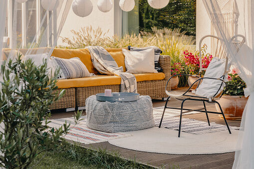 <p><span style="font-weight: 400;">Level up with an outdoor fabric couch, chairs, pillows, and blankets to relax outside in total comfort!</span></p>
<p><span style="font-weight: 400;"> </span><span style="font-weight: 400;">Photo Credit: </span><a href="https://www.gettyimages.com/"><span style="font-weight: 400;">G</span><span style="font-weight: 400;">ettyImages</span></a><span style="font-weight: 400;">, </span><a href="https://www.gettyimages.com/detail/photo/real-photo-of-an-armchair-pouf-as-a-table-and-royalty-free-image/1143981417"><span style="font-weight: 400;">KatarzynaBialasiewicz</span></a></p>
