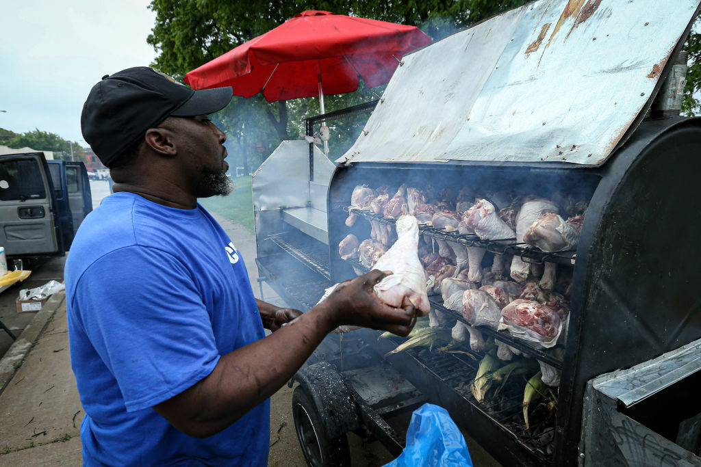 MILWAUKEE, WISCONSIN - JUNE 19:  A vendor prepares food during the 48th Annual Juneteenth Day Festival on June 19, 2019 in Milwaukee, Wisconsin. (Photo by Dylan Buell/Getty Images for VIBE)