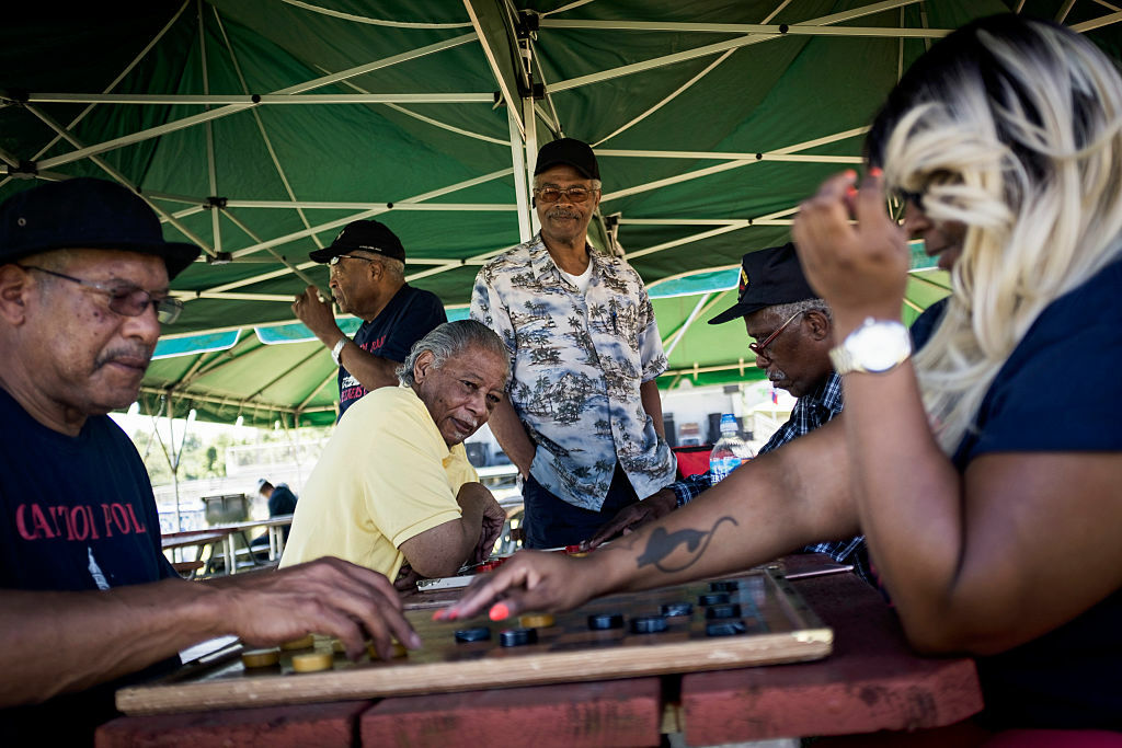 DISTRICT HEIGHTS, MD - JUNE 18: Donald Cunningham, left, brings his Capital Pool Checkers Club to Walker Mill Regional Park for Juneteenth celebrations in District Heights, Maryland Saturday June 18, 2016. (Photo by J. Lawler Duggan/For The Washington Post via Getty Images)