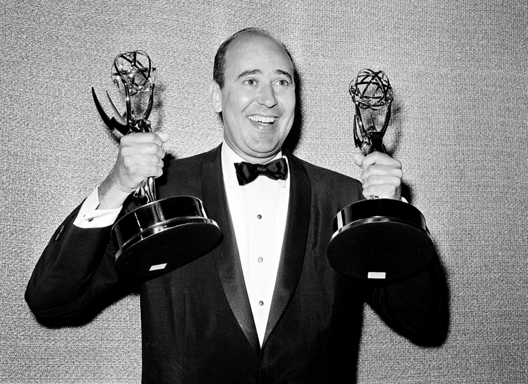 In this May 26, 1963 file photo, Carl Reiner shows holds two Emmy statuettes presented to him as best comedy writer for the "Dick Van Dyke Show," during the annual Emmy Awards presentation in Los Angeles. Reiner, the ingenious and versatile writer, actor and director who broke through as a “second banana” to Sid Caesar and rose to comedy’s front ranks as creator of “The Dick Van Dyke Show” and straight man to Mel Brooks’ “2000 Year Old Man,” has died, according to reports. Variety reported he died of natural causes on Monday night, June 29, 2020, at his home in Beverly Hills, Calif. He was 98. (AP Photo, File)