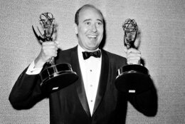 In this May 26, 1963 file photo, Carl Reiner shows holds two Emmy statuettes presented to him as best comedy writer for the "Dick Van Dyke Show," during the annual Emmy Awards presentation in Los Angeles. Reiner, the ingenious and versatile writer, actor and director who broke through as a “second banana” to Sid Caesar and rose to comedy’s front ranks as creator of “The Dick Van Dyke Show” and straight man to Mel Brooks’ “2000 Year Old Man,” has died, according to reports. Variety reported he died of natural causes on Monday night, June 29, 2020, at his home in Beverly Hills, Calif. He was 98. (AP Photo, File)