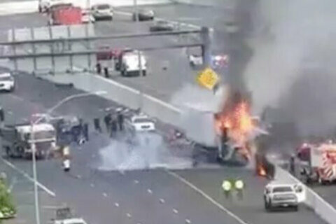 Car, tractor-trailer involved in fiery crash on Baltimore Beltway