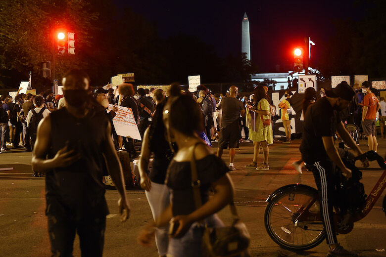 People gather to protest against racism and police brutality in front of the White House in Washington, DC on June 7, 2020 in Washington, DC. - On May 25, 2020, Floyd, a 46-year-old black man suspected of passing a counterfeit $20 bill, died in Minneapolis after Derek Chauvin, a white police officer, pressed his knee to Floyd's neck for almost nine minutes. (Photo by Olivier DOULIERY / AFP) (Photo by OLIVIER DOULIERY/AFP via Getty Images)