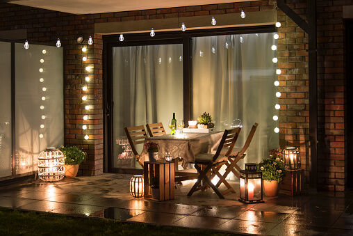 <p><span style="font-weight: 400;">Bring touches of home to your backyard with lights, candles and a tablecloth. With an outdoor dining area like this, who needs a dining room?</span></p>
<p><span style="font-weight: 400;">Photo Credit: </span><a href="https://www.gettyimages.com/"><span style="font-weight: 400;">GettyImages</span></a><span style="font-weight: 400;">, </span><a href="https://www.gettyimages.com/detail/photo/summer-evenig-terrace-with-candles-wine-and-lights-royalty-free-image/1135183699"><span style="font-weight: 400;">Jakub Mazur</span></a></p>
