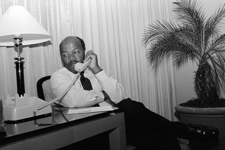 John Lewis talks on the telephone form his Atlanta hotel room Tuesday night, Sept. 2, 1986 prior to claiming victory by defeating Julian Bond in a runoff election for the fifth Congressional District seat in Georgia. The two were civil rights movement allies. (AP Photo/Linda Shaeffer)