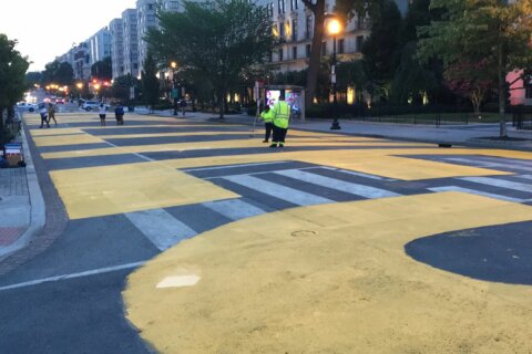 DC’s Black Lives Matter Plaza gets fresh coat of paint for John Lewis procession