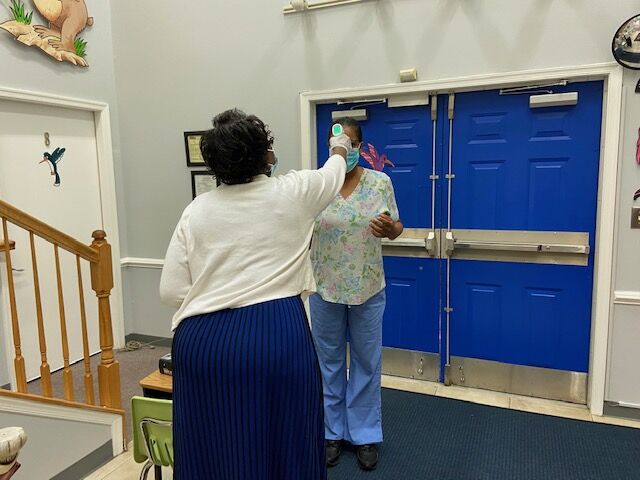 Children and parents get their temperature checked on the way in the door. Parents cannot go with their children into the center, even if they pass the screening. 