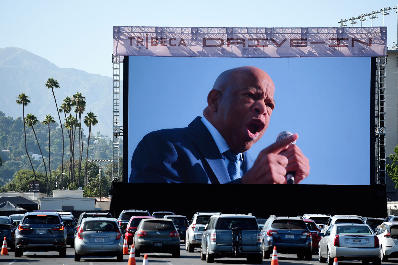 Rep. John Lewis, D-Ga., is seen onscreen in a scene from the documentary film "John Lewis: Good Trouble," on the opening night of the Tribeca Drive-In, Thursday, July 2, 2020, at the Rose Bowl in Pasadena, Calif. Complimentary access was offered to essential workers for the first night of the limited-engagement drive-in film series. (AP Photo/Chris Pizzello)