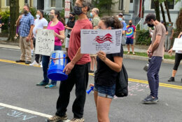 Protesters outside U.S. postmaster general's D.C. condo