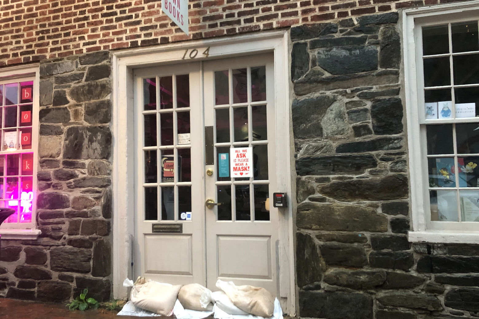 Old Town Alexandria sandbags in front of a business