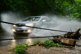 car travels through a puddle