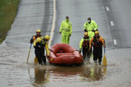 Crews launching an inflatable boat to rescue a stranded driver on Route 50 in Cheverly, Maryland, Sept. 10, 2020. (WTOP/Dave Dildine)