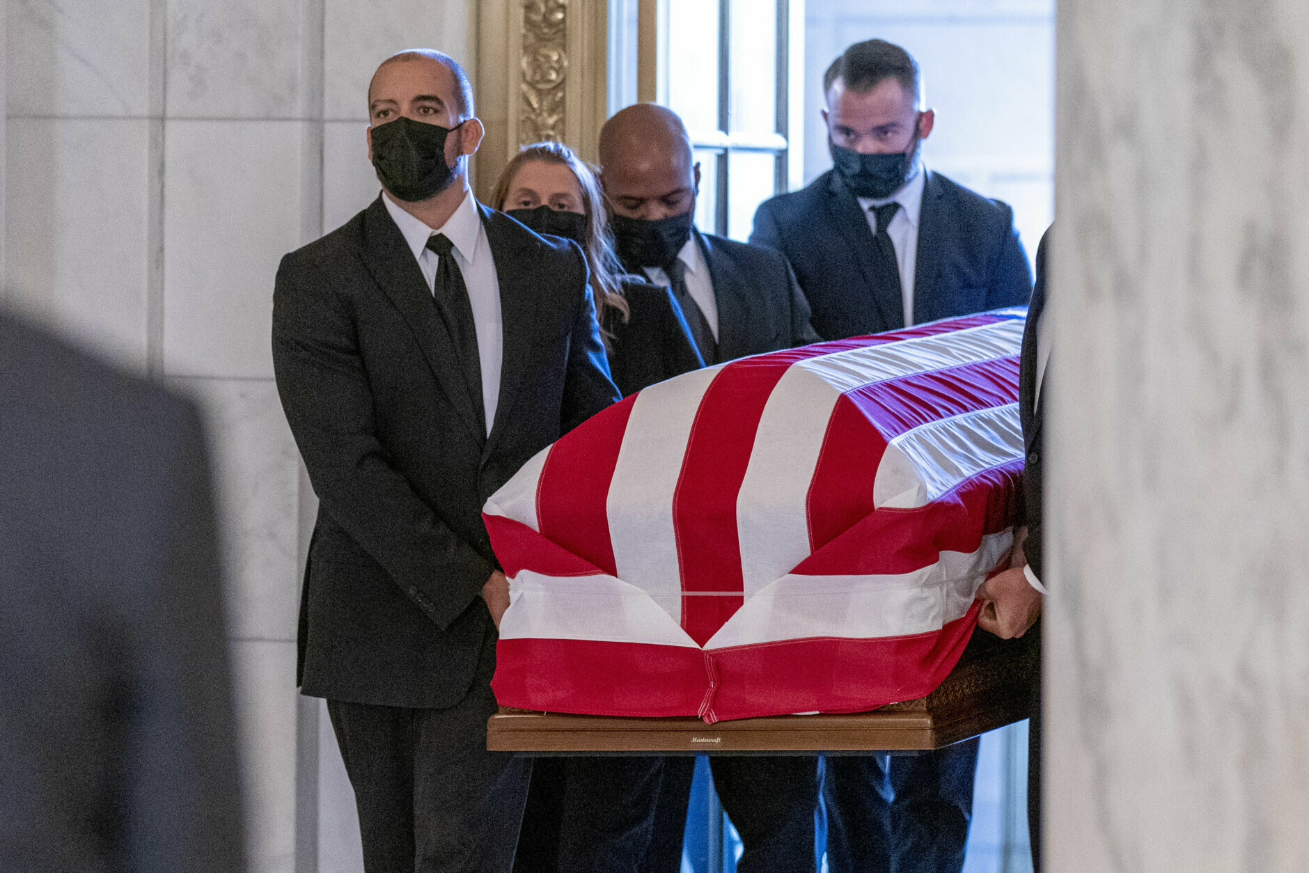 The flag-draped casket of Justice Ruth Bader Ginsburg arrives at the Supreme Court in Washington, Wednesday, Sept. 23, 2020. Ginsburg, 87, died of cancer on Sept. 18. (AP Photo/Andrew Harnik, Pool)