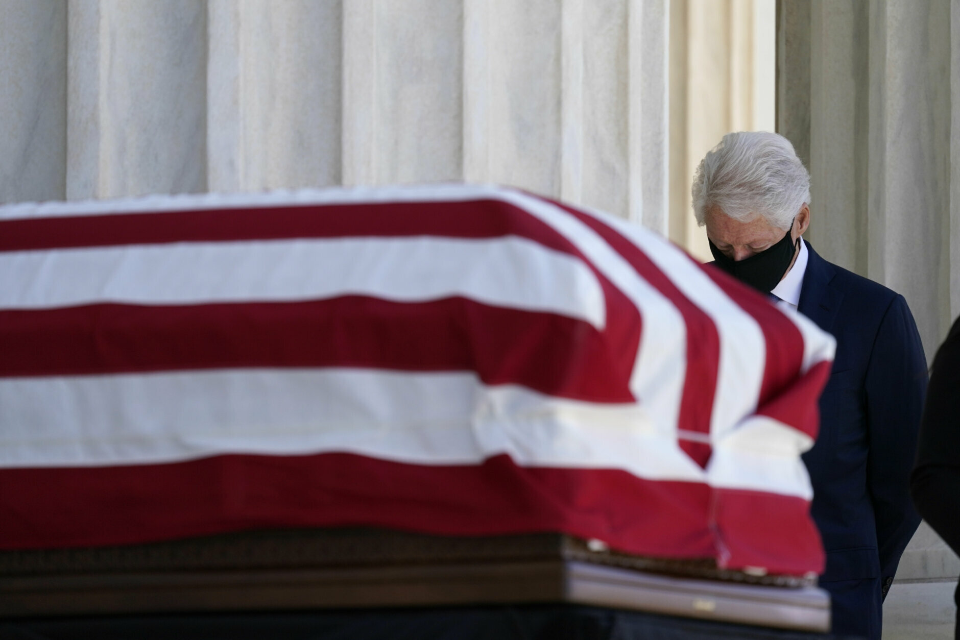 Former President Bill Clinton pays respects as Justice Ruth Bader Ginsburg lies in repose under the Portico at the top of the front steps of the U.S. Supreme Court building on Wednesday, Sept. 23, 2020, in Washington. Ginsburg, 87, died of cancer on Sept. 18. (AP Photo/Alex Brandon, Pool)