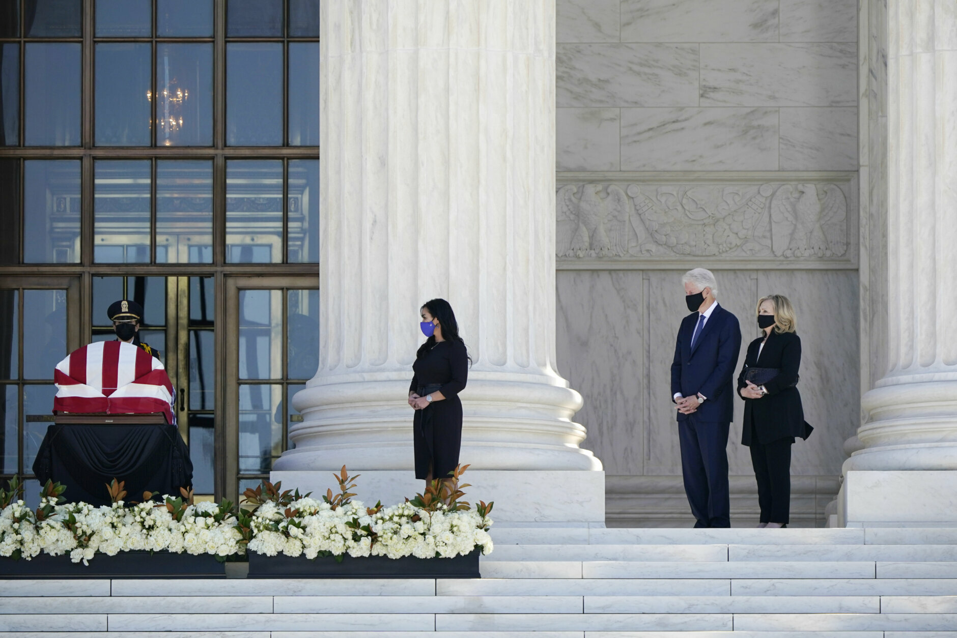 Former President Bill Clinton, second from right, and former Secretary of State Hillary Clinton pay respects as Justice Ruth Bader Ginsburg lies in repose under the Portico at the top of the front steps of the U.S. Supreme Court building on Wednesday, Sept. 23, 2020, in Washington. Ginsburg, 87, died of cancer on Sept. 18. (AP Photo/J. Scott Applewhite)