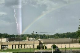 <p>A rainbow, lightning and an unidentified beam of light meet amid Thursday&#8217; storms.</p>
