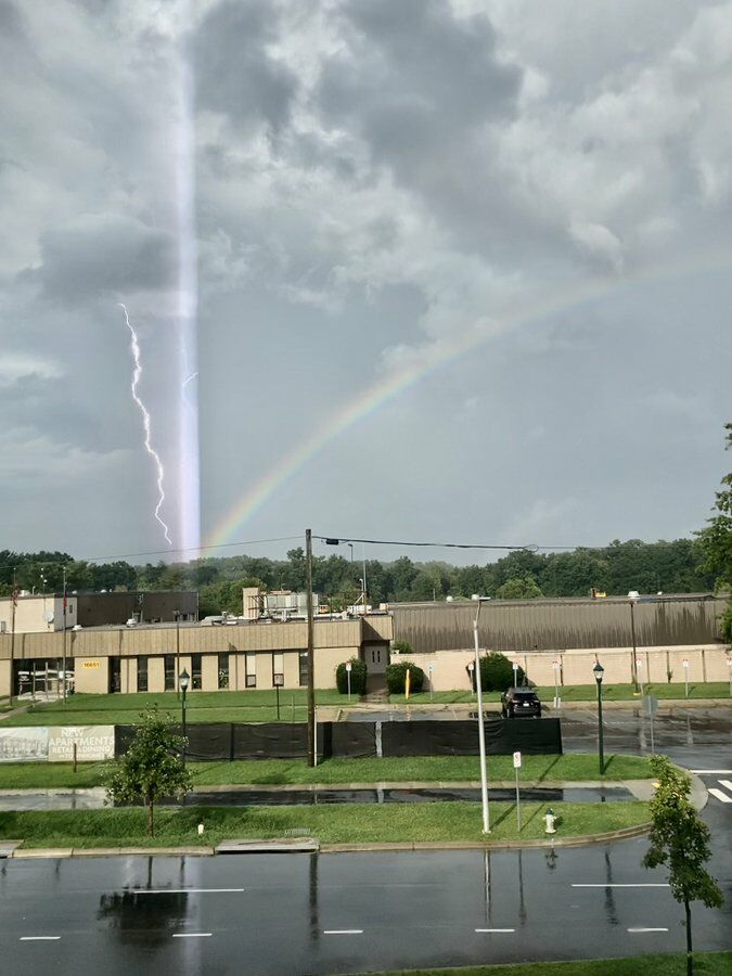 <p>A rainbow, lightning and an unidentified beam of light meet amid Thursday&#8217; storms.</p>
