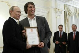 <p>Russian President Vladimir Putin and Ovechkin pose with a certificate of recognition in May 2012. The Russian national team won the IIHF World Championship that year. Also pictured are Russian ice hockey federation president Vladislav Tretiak and Russia&#8217;s team captain, Ilya Nikulin.</p>
