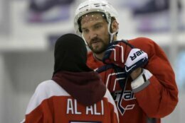 <p>Fatima Al Ali — an Abu Dhabi-based ice hockey player, coach and referee — talks with Ovechkin during a Caps practice in February 2017.</p>
