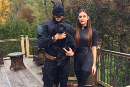 <p>Ovi and his now-wife, Nastasiya, dressed up as Batman and the Catwoman for Halloween in 2015. Also pictured is their pup, Blaik.</p>
