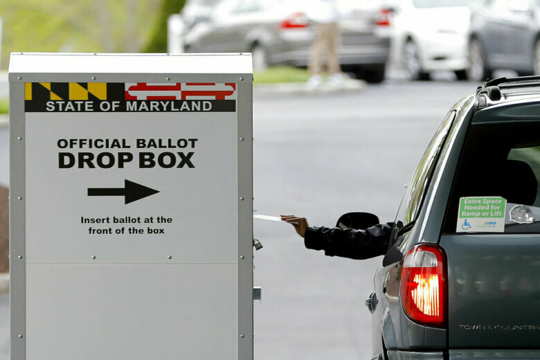 Dropping off ballot to vote in Maryland
