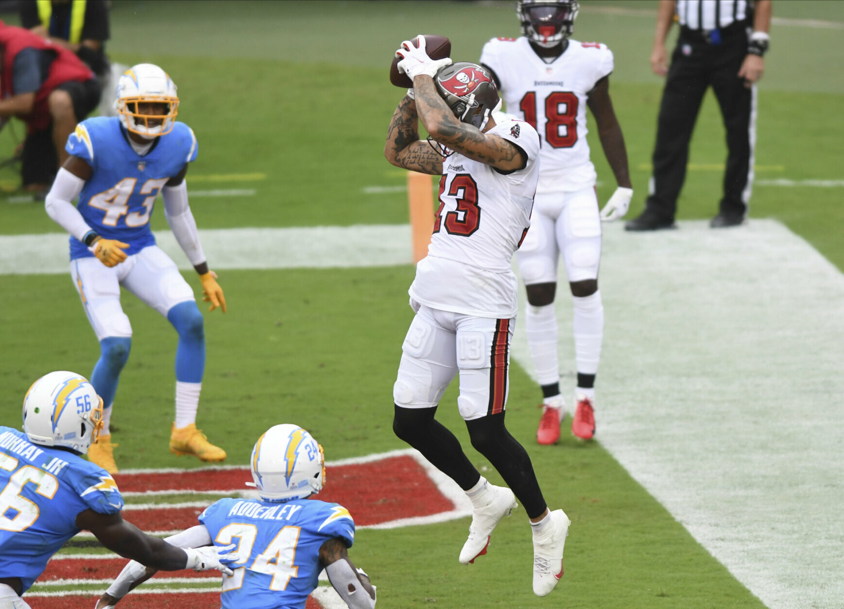 <p><b><i>Chargers 31</i></b><br />
<b><i>Bucs 38</i></b></p>
<p><a href="https://www.tampabay.com/sports/bucs/2020/09/30/mike-evans-downplays-war-of-words-with-keenan-allen-as-chargers-come-to-town/">Mike Evans moonwalked off criticizing Keenan Allen</a> and then moonwalked into the end zone for one of Tom Brady&#8217;s five touchdown passes, helping TB become the oldest player to have a five-TD game. But will the GOAT&#8217;s 43-year-old arm have enough juice to play a Thursday night game in Chicago?</p>
