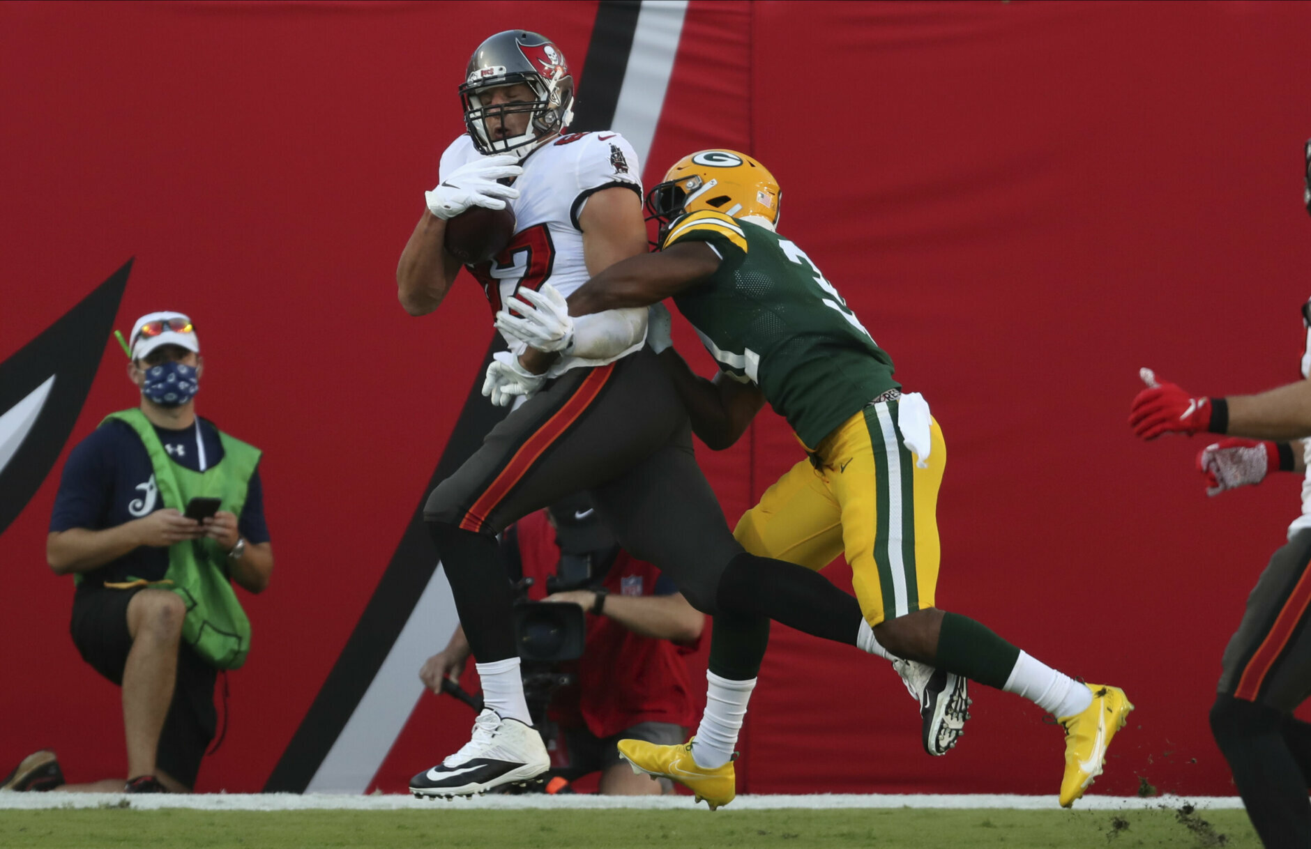<p><b><i>Packers 10</i></b><br />
<b><i>Bucs 38</i></b></p>
<p>Aaron Rodgers threw <a href="https://profootballtalk.nbcsports.com/2020/10/18/aaron-rodgers-throws-third-career-pick-six-on-his-6215th-career-pass/">a stunningly rare Pick Six</a>, Tom Brady reestablished his connection with Gronk and Tampa Bay had its second penalty-free game in franchise history. Despite <a href="https://www.espn.com/nfl/story/_/id/30143617/green-bay-packers-qb-aaron-rodgers-no-match-tampa-bay-buccaneers-defense-picked-twice-loss" target="_blank" rel="noopener">Rodgers&#8217; spin</a>, this is a statement win for the Bucs that might also give them the leg up on Green Bay in a potential playoff rematch.</p>
