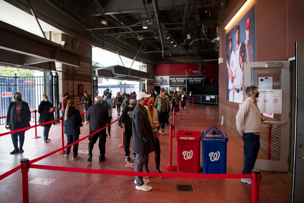 UNITED STATES - OCTOBER 27: Voters wait in line to cast their ballots at an early voting center at Nationals Park in Washington on Tuesday, Oct. 27, 2020. (Photo by Caroline Brehman/CQ-Roll Call, Inc via Getty Images)