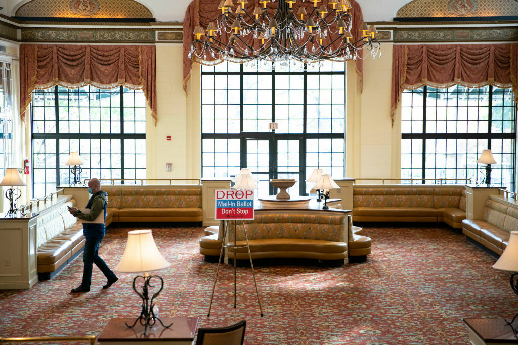 WASHINGTON, DC - OCTOBER 27: A man is seen in the lobby of the Omni Shoreham Hotel after casting his ballot at an early voting center on October 27, 2020 in Washington, DC. Early voting for the 2020 general election starts today in Washington, DC at 32 polling locations across the city and runs through November 2. (Photo by Sarah Silbiger/Getty Images)