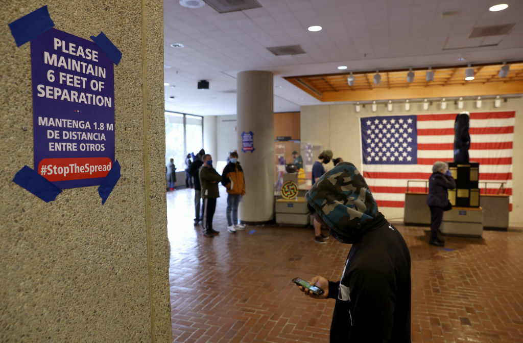 ROCKVILLE, MARYLAND - OCTOBER 26: People wait in line to vote at the Montgomery County Executive Office Building on October 26, 2020 in Rockville, Maryland. Today marks the first day of early in-person voting in the state of Maryland. (Photo by Win McNamee/Getty Images)