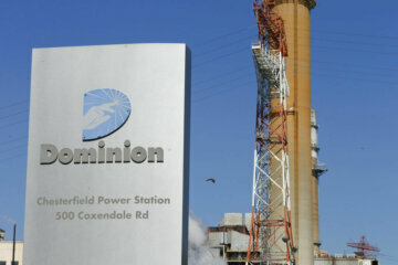 FILE - This Wednesday, April 29, 2015, file photo, shows Dominion Energy's coal fired power plant along the James River in Chester, Va. (AP Photo/Steve Helber)