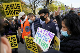 Demonstrators stop to pray outside the White House, Tuesday, Nov. 3, 2020, in Washington. (AP Photo/Jacquelyn Martin)